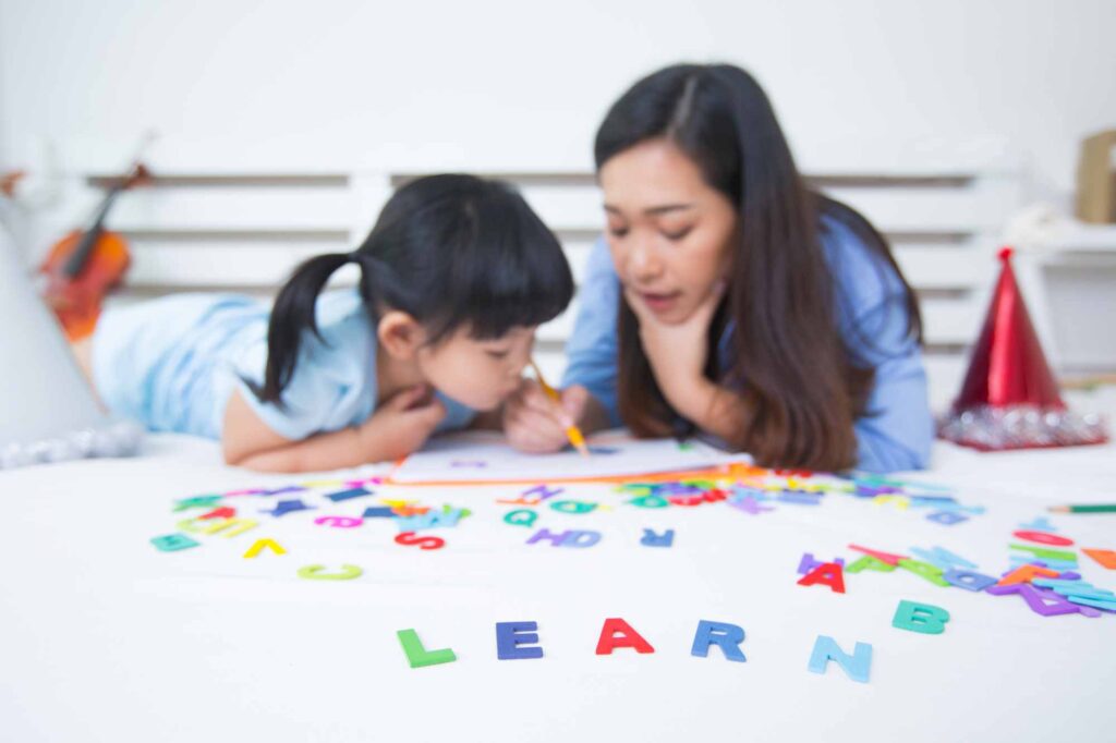 mother and daughter studying